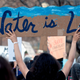 Native Americans and indigenous rights activists march and hold up signs in protest during a Native Nations March in Denver, Colorado, on March 10, 2017.